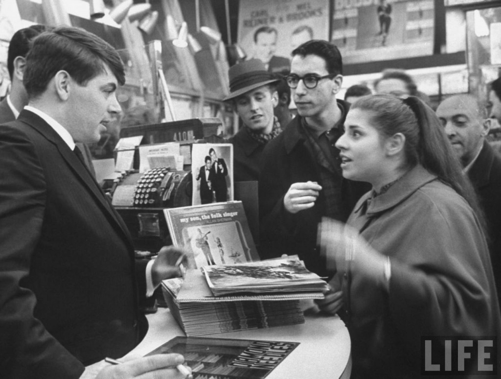 Vaughn Meader pitches his LP to customers at a NYC record store in December 1963.