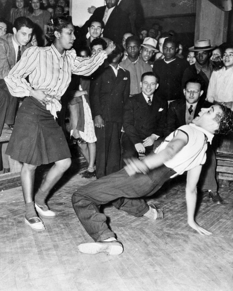 Black and Latino teenagers dancing to popular rhythm and blues hits in the early-1950s.